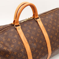 Détail anses cuir vachette patine caramel Louis Vuitton Keepall 55 — AMANA Vintage