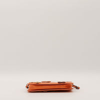 Pochette Louis Vuitton Vernis Fleurs vue du dessous cuir verni orange — AMANA Vintage