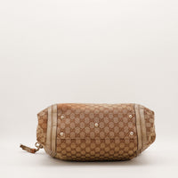 Hobo Bambou Gucci vue du fond avec pieds métalliques et canvas monogrammé — AMANA Vintage
