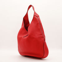 Hobo Hermès rouge vue de trois quarts droite silhouette souple — AMANA Vintage