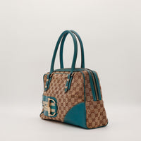 Vue de trois quarts Gucci Tote Horsebit bicolore beige turquoise occasion — AMANA Vintage
