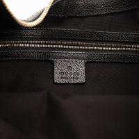 Intérieur doublure textile noire et plaque Gucci made in Italy — AMANA Vintage