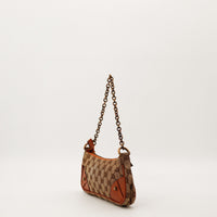Vue de profil Gucci Hobo Chain canvas GG chaîne bronze occasion — AMANA Vintage