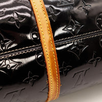 Detail anse en cuir vachette patine caramel Louis Vuitton Bedford — AMANA Vintage