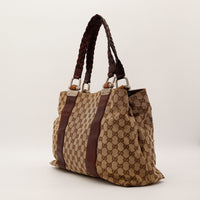 Vue de trois quarts Tote Bag Bambou Gucci canvas beige anses tressees — AMANA Vintage