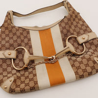 Détail mors Horsebit doré et chaîne sac Gucci Hobo occasion authentique — AMANA Vintage