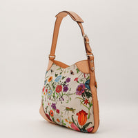 Gucci Hobo Jackie Flora vue de trois quarts cote gauche silhouette souple — AMANA Vintage