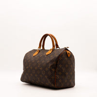 Louis Vuitton Speedy 30 vue trois quarts toile Monogram patine caramel — AMANA Vintage