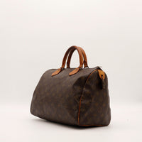 Louis Vuitton Speedy 30 vue de trois quarts toile Monogram cuir vachette — AMANA Vintage
