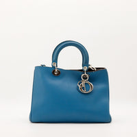 Sac Christian Dior Diorissimo cuir lisse bleu canard vue de face occasion authentique — AMANA Vintage