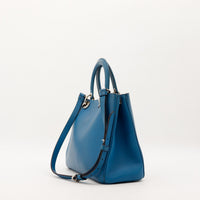 Vue laterale sac Dior Diorissimo bleu canard structure elegante — AMANA Vintage