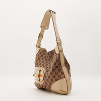 Gucci Hobo Horsebit vue de trois quarts gauche cuir ivoire canvas beige — AMANA Vintage