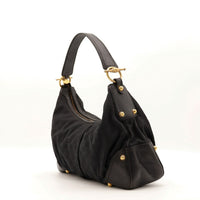 Vue de profil Gucci Indy Hobo noir fond plat pieds dorés — AMANA Vintage