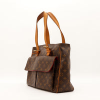 Vue de trois quarts Louis Vuitton Multipli Cité toile Monogram poche latérale visible — AMANA Vintage