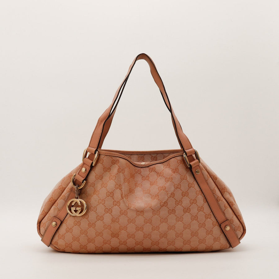 Sac Gucci Hobo toile monogrammée rose poudré vue de face occasion authentique — AMANA Vintage