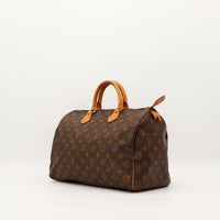 Vue trois quarts Louis Vuitton Speedy 40 anses vachette patine caramel — AMANA Vintage