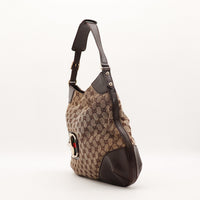 Vue de profil Hobo Horsebit Gucci bandoulière cuir marron — AMANA Vintage