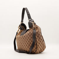 Hobo Gucci vue de trois quarts dos bandoulière croisée cuir grainé — AMANA Vintage
