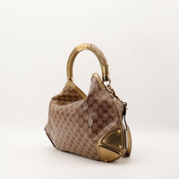 Gucci Indy Hobo vue trois quarts droite detail cuir dore occasion — AMANA Vintage