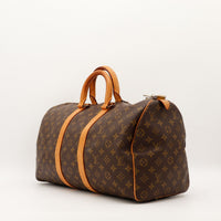 Louis Vuitton Keepall 45 vue de trois quarts sangles cuir vachette occasion authentique — AMANA Vintage