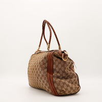 Sac Gucci Hobo toile monogrammée vue latérale occasion authentique — AMANA Vintage