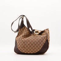 Sac Gucci Hobo GG embout doré G vue trois quarts occasion authentique — AMANA Vintage