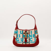 Gucci Jackie 1961 édition Music Is Mine toile écrue imprimée cuir rouge vue de face occasion authentique — AMANA Vintage