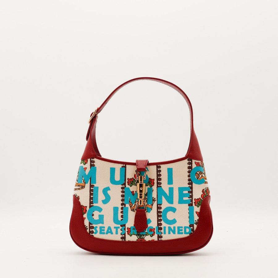 Gucci Jackie 1961 édition Music Is Mine toile écrue imprimée cuir rouge vue de face occasion authentique — AMANA Vintage