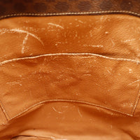 Détail intérieur fond Céline Seau Macadam doublure griffures et décoloration — AMANA Vintage