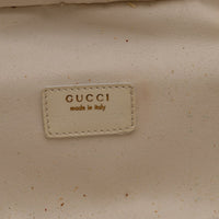 Détail plaque Gucci made in Italy numéro de série 032·200159·0150 — AMANA Vintage