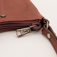 Détail tirette YSL et fermeture éclair Yves Saint Laurent Mombasa Hobo — AMANA Vintage
