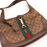 Détail fermoir piston Gucci Jackie bande Web occasion authentique — AMANA Vintage