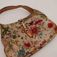 Detail anse et fermoir piston Gucci Jackie Flora occasion authentique — AMANA Vintage