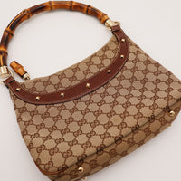 Détail anse bambou et clous Gucci Hobo Bamboo occasion authentique — AMANA Vintage