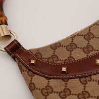 Détail attache cuir et clous Gucci Hobo Bamboo occasion authentique — AMANA Vintage