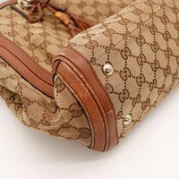 Détail coin cuir marron Gucci Tote Bag frottements occasion authentique — AMANA Vintage