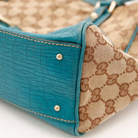 Détail coin cuir turquoise craquelé Gucci Tote Horsebit occasion — AMANA Vintage