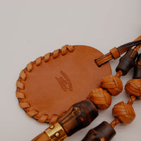 Détail charm breloque ronde cuir Gucci made in Italy — AMANA Vintage
