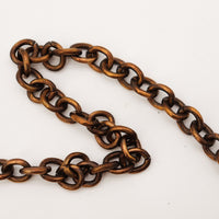 Détail chaîne bronze patinée Gucci Hobo Chain occasion — AMANA Vintage