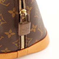 Détail cadenas signé Louis Vuitton Alma PM — AMANA Vintage