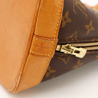 Détail date code et zip doré Louis Vuitton Alma PM — AMANA Vintage