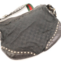 Détail toile monogrammée et cuir clouté Gucci Hobo occasion authentique — AMANA Vintage