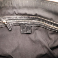 Intérieur doublure textile noire et étiquette Gucci Hobo occasion authentique — AMANA Vintage