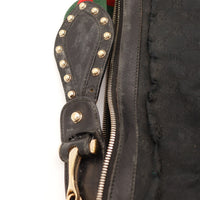 Détail anse cloutée et zip Gucci Hobo occasion authentique — AMANA Vintage