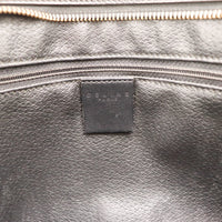 Intérieur cuir noir et étiquette Céline Paris de la pochette Macadam — AMANA Vintage