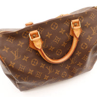 Détail anses patine caramel attaches vachette Louis Vuitton Speedy 30 — AMANA Vintage