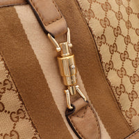 Détail fermoir piston doré Gucci New Jackie toile monogrammée — AMANA Vintage
