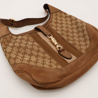 Sac Gucci New Jackie posé à plat vue de dessus fermoir doré — AMANA Vintage