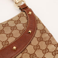Détail bande cuir marron et clous dorés Gucci Hobo Bambou — AMANA Vintage