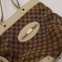 Detail fermoir Horsebit Gucci dore canvas GG — AMANA Vintage